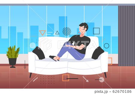 sick man with fever and red rash coronavirus infection symptoms epidemic MERS-CoV virus wuhan 2019-nCoV pandemic health risk concept living room interior full length horizontal 62670186