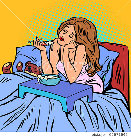 woman eating porridge. Breakfast in bed 62671645