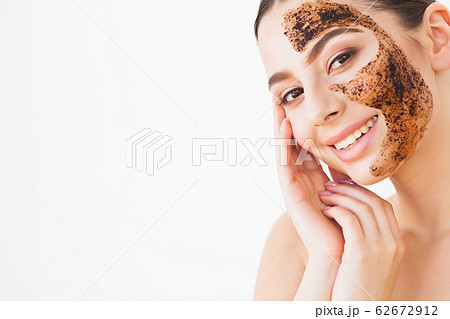 Beautiful young woman with cosmetic spa facial mask Beautiful young woman with cosmetic spa facial mask 62672912