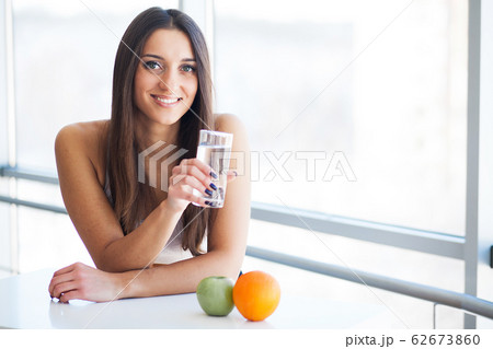 Young woman drinking water. Drinking fresh water Young woman drinking water. Drinking fresh water 62673860