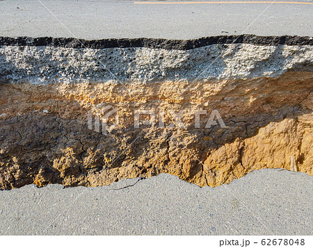 The layer of asphalt road with soil and gravel. The layer of asphalt road with soil and gravel. 62678048
