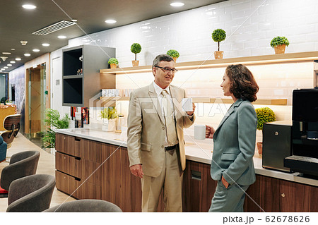 Business people in office kitchen 62678626