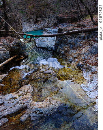 stream of water in a rocky valley 62679322