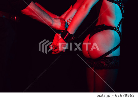 male dominant handcuffs slave girl in lingerie 62679965