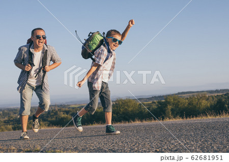 Father and son playing on the road at the day Father and son playing on the road at the day 62681951