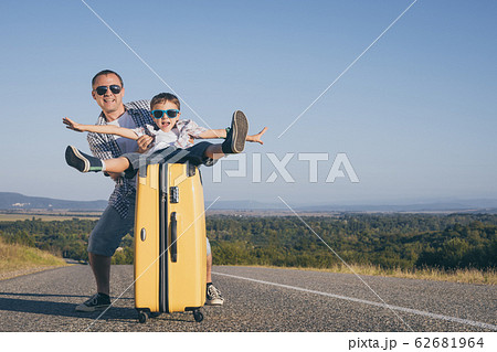 Father and son playing on the road at the day Father and son playing on the road at the day 62681964