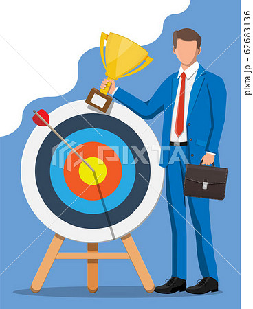 Businessman with trophy, dart target 62683136