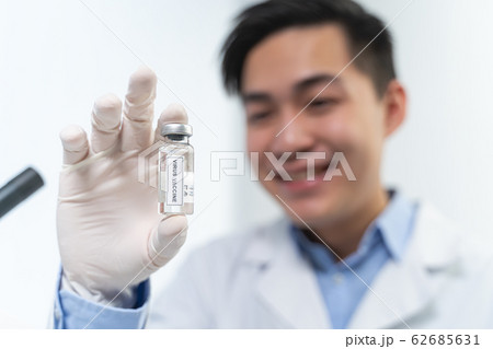 Delighted scientist demonstrating result of his work Delighted scientist demonstrating result of his work 62685631
