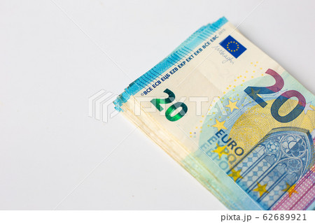 Pile of Euro money note bills on white background Pile of Euro money note bills on white background 62689921