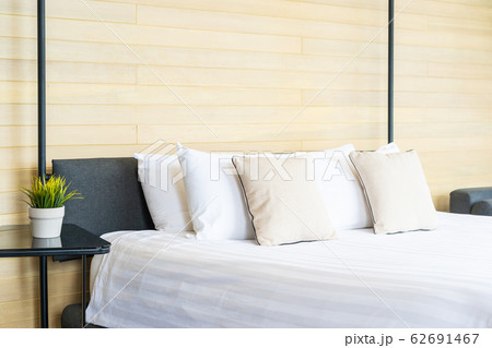 White comfortable pillow on bed decoration interior of bed room 62691467
