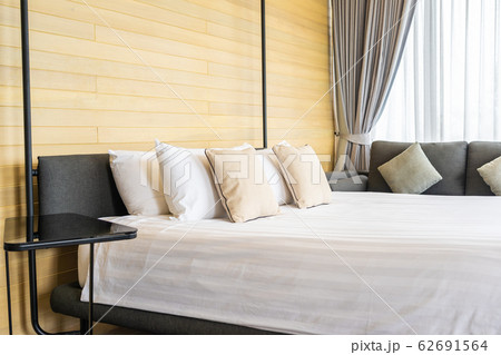 White comfortable pillow on bed decoration interior of bed room White comfortable pillow on bed decoration interior of bed room 62691564