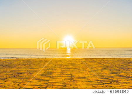 Beautiful tropical beach sea ocean with sunset or sunrise for travel vacation 62691849