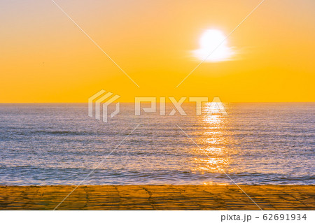 Beautiful tropical beach sea ocean with sunset or sunrise for travel vacation Beautiful tropical beach sea ocean with sunset or sunrise for travel vacation 62691934