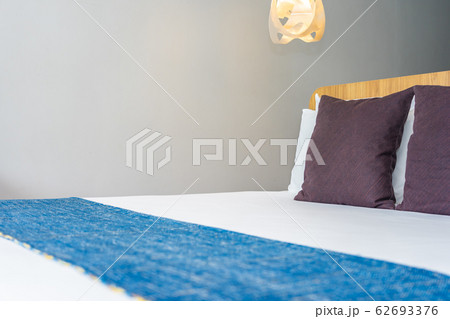 White pillow on bed decoration interior White pillow on bed decoration interior 62693376