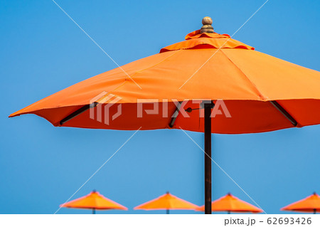 Umbrella with beautiful blue sky background nearly sea ocean beach Umbrella with beautiful blue sky background nearly sea ocean beach 62693426