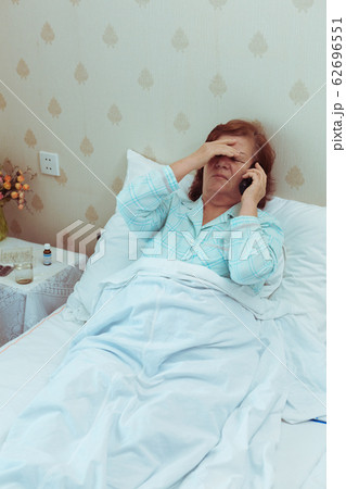 Sick elderly woman call ambulance, heart attack.Retired female feeling unwell and calling doctor. Sick elderly woman call ambulance, heart attack.Retired female feeling unwell and calling doctor. 62696551