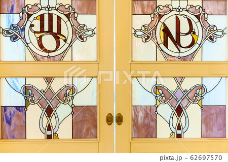 The medieval stained glass on the door 62697570