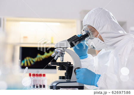 Studying virus in microscope 62697586