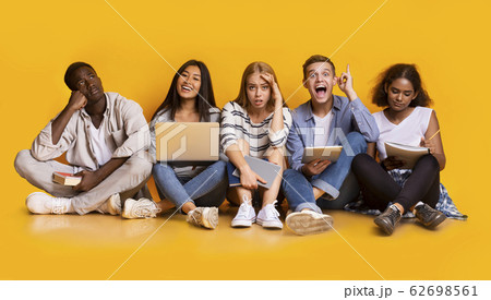 Group of exhausted students studying for school exams 62698561