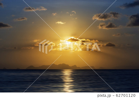Sunset sky at the lake with dark clouds 62701120