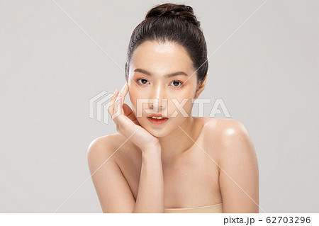 Beautiful Young Asian Woman smile feeling so happy and cheerful with healthy Clean and Fresh skin Beautiful Young Asian Woman smile feeling so happy and cheerful with healthy Clean and Fresh skin 62703296