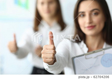 Pretty businesswoman at workplace Pretty businesswoman at workplace 62704206