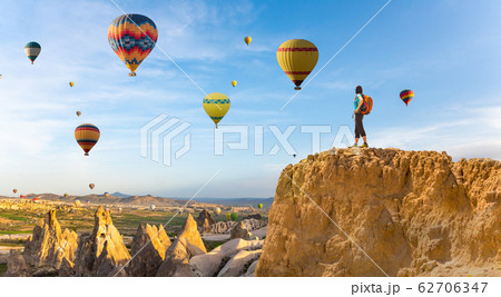 successful woman and hot air balloon Concept motivation, inspiration 62706347