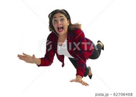 A second before falling - young girl falling down with bright emotions and expression 62706408