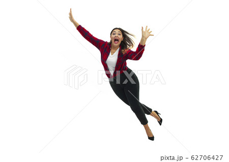 A second before falling - young girl falling down with bright emotions and expression A second before falling - young girl falling down with bright emotions and expression 62706427