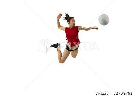 Young female volleyball player isolated on white studio background in flight and motion 62708762