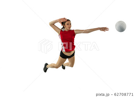 Young female volleyball player isolated on white studio background in flight and motion 62708771