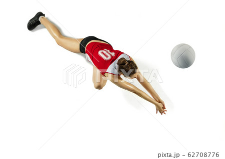 Young female volleyball player isolated on white studio background in flight and motion Young female volleyball player isolated on white studio background in flight and motion 62708776