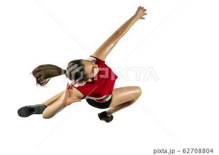 Young female volleyball player isolated on white studio background in flight and motion 62708804