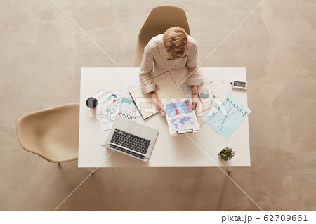 Businesswoman at Desk Above View 62709661