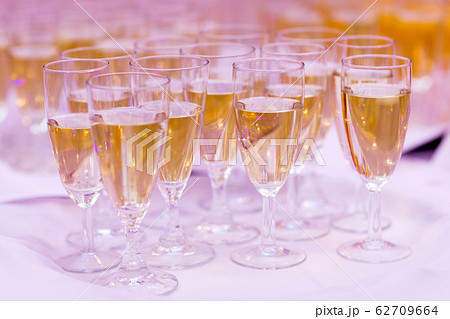 lot of glasses with champagne during on the party table 62709664