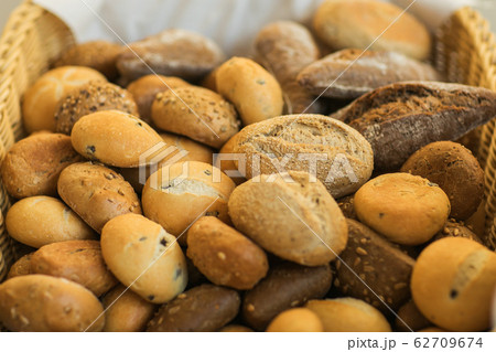 Fresh homemade bread rolls in little basket Fresh homemade bread rolls in little basket 62709674
