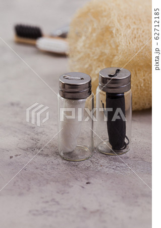 Zero waste home concept. Eco dental floss, white and black on concrete natural background 62712185