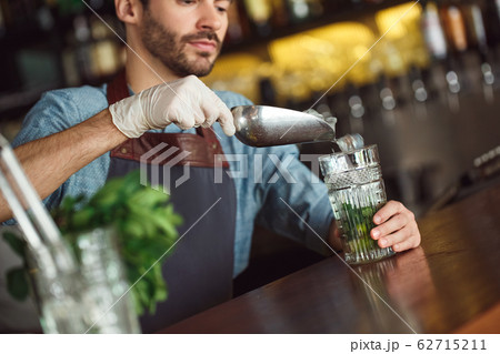 Bartender Using Shaker Making Cocktail Standing at Bar Counter Indoor Stock  Photo - Image of machine, adult: 174551898