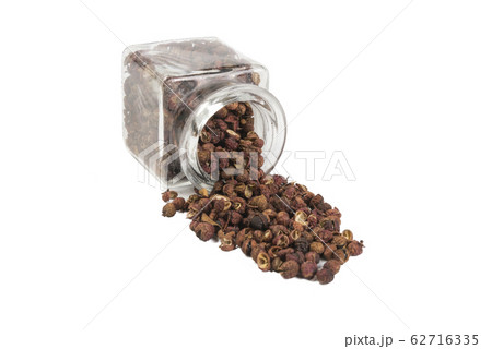 sichuan pepper in a glass jar isolated on white 62716335