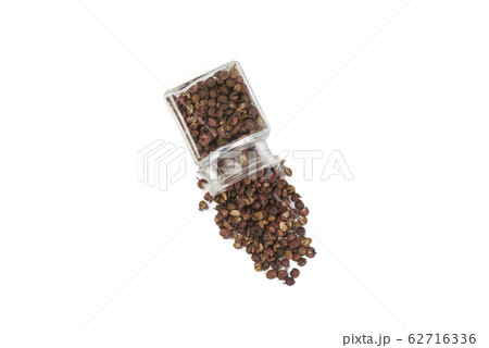 sichuan pepper in a glass jar isolated on white 62716336