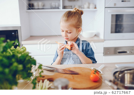 little girl in a kitchen 62717667