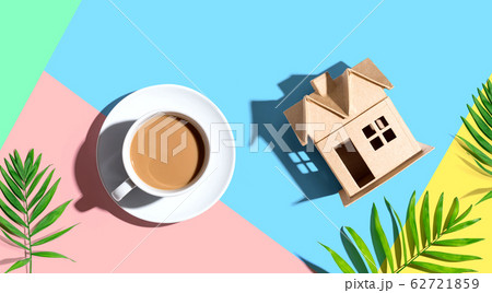 Cardboard house with a cup of coffee Cardboard house with a cup of coffee 62721859