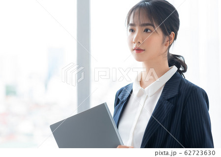 A business woman beside the window A business woman beside the window 62723630