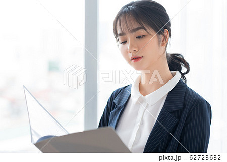 A business woman beside the window 62723632