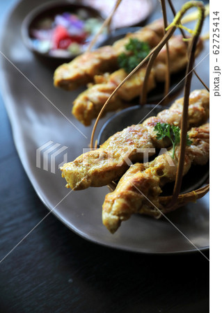 Chicken Satay on dark brown table street food appetizer Chicken Satay on dark brown table street food appetizer 62725414