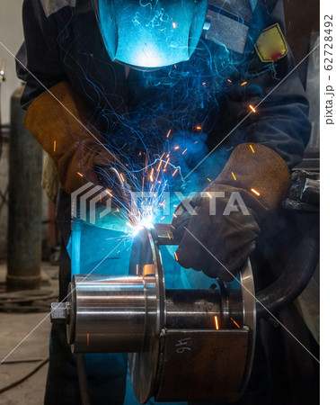 welding works at a Metalworking company, welder welding works at a Metalworking company, welder 62728492