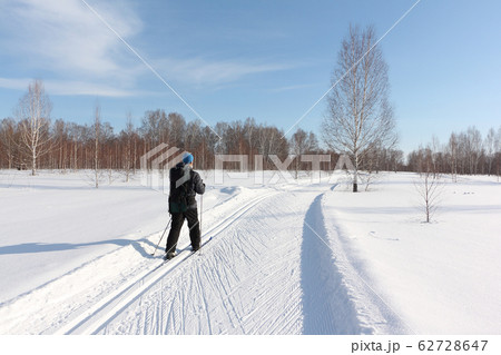 Man with a backpack skiing on a ski track 62728647
