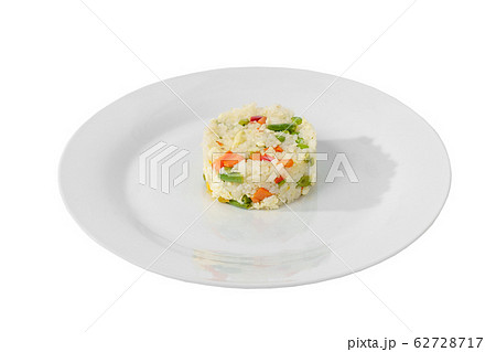 Rice with vegetables portion on a plate isolated 62728717