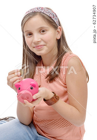 preteen with a piggy bank, on white 62734907