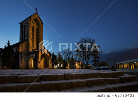 ancient stone church of sapa with blue night sky 62735403